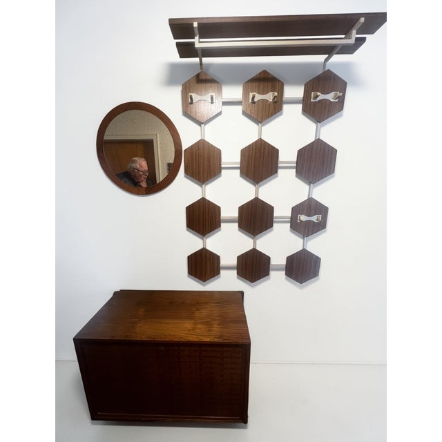 Rare and highly sculptural Danish Modern entryway ensemble consisting of an original Poul Cadovius wall-mounted shoe...