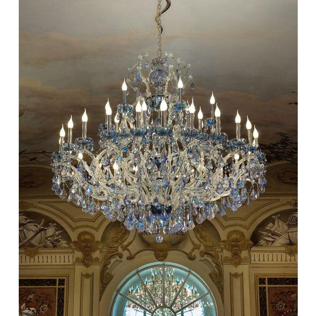 Maria theresa 30 lights chandelier in polished chrome and crystal by aggiolight. Dimensions: d 125 x h 120 cm. Materials:...