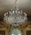 Maria theresa 30 lights chandelier in polished chrome and crystal by aggiolight. Dimensions: d 125 x h 120 cm. Materials:...