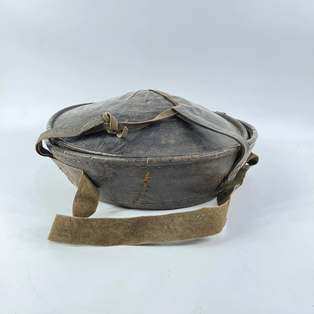 An Ethiopian leather-covered bread basket with a gorgeous patina. Baskets such as this are found among the Oromo and other...