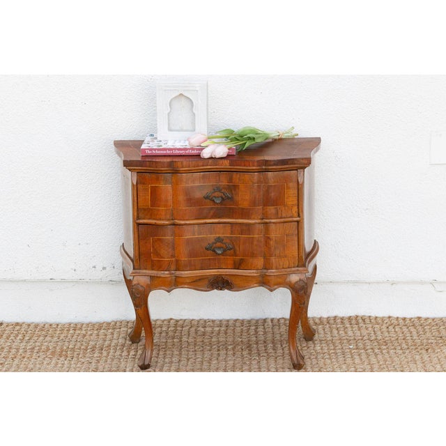 Invite a touch of old-world elegance and classic European charm into your bedroom with this delightful small walnut...