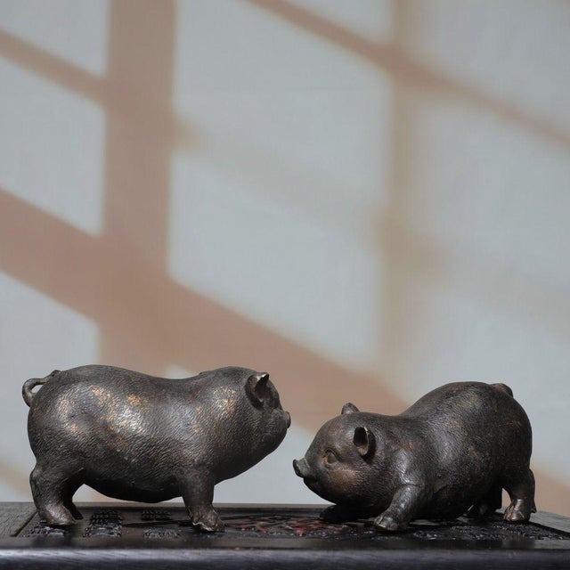 This is a charming vintage pair of Chinese bronze pig figures, sourced from an old collection. Each pig is finely cast...