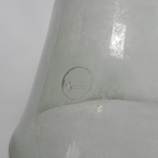 These types of bell jars were used in the (vegetable) garden. The glass makes it work like a kind of mini greenhouse...