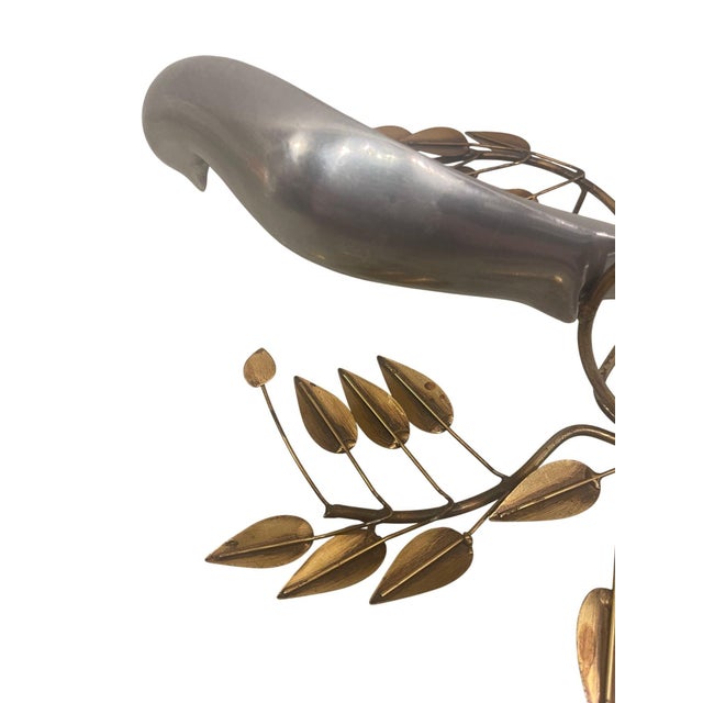 An elegant and highly collectible pair of signed Curtis Jere bird wall sculptures, dated 1980. These sculptural works...