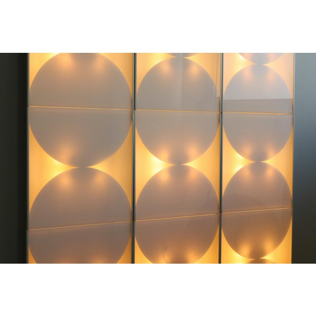 An exceptional and refined set of nine "Hourglass" wall sconces, designed by Bobo Piccoli for Fontana Arte in the 1970s....