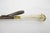 Vintage shoe horn featuring a natural Ox horn tongue and stag antler handle. Wooden shaft with a brass sleeves. Measures...