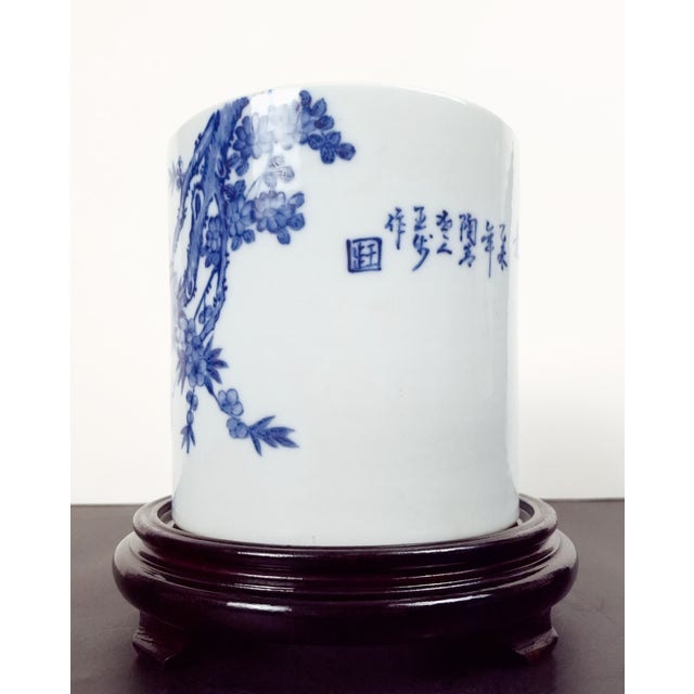 Chinese porcelain rooster bitong, a finely formed brush pot with straight sides, a blue and white glazed exterior and a...