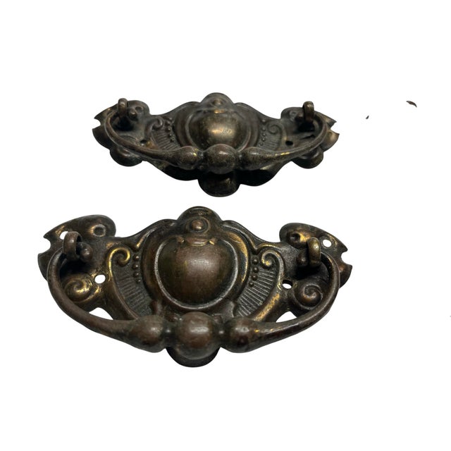 Wonderfully decorative French antique set of four brass bar pulls with screws. Straight from the Paris flea markets....