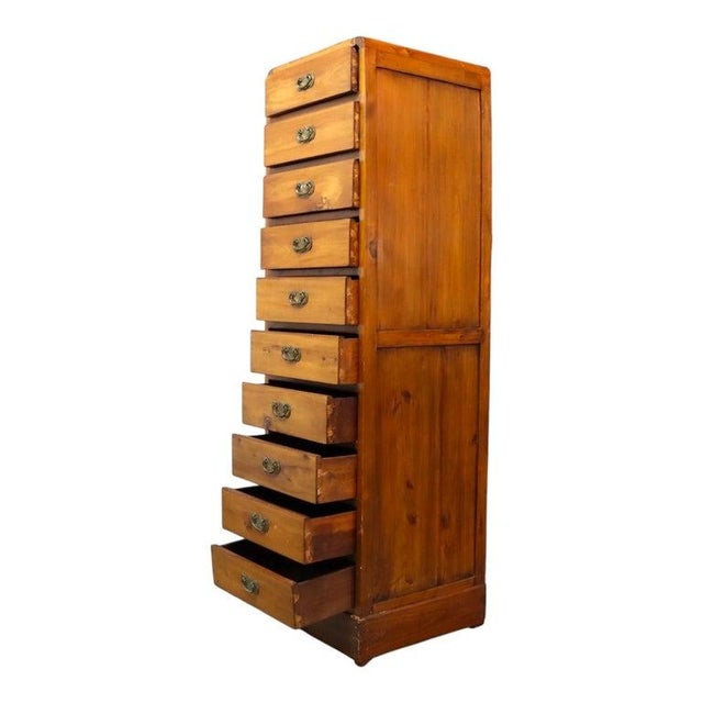 An oversized antique lingerie chest, crafted from mahogany, featuring a tall and slender profile. This chest is designed...