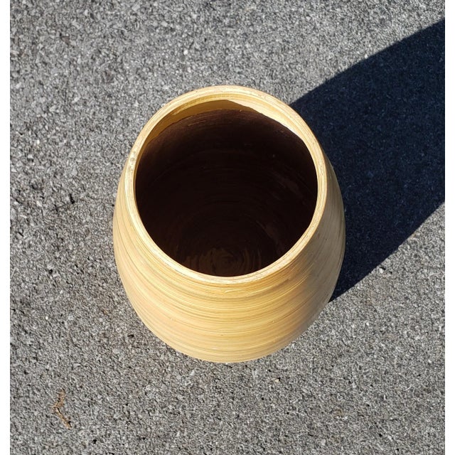 Late 20th-century Handcrafted from natural bamboo, this vase is lightweight and easy to handle and move. The stained color...