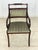 Elegant set of two vintage dining chairs from the 1960s. The chairs impress with their curved armrests, decorative...