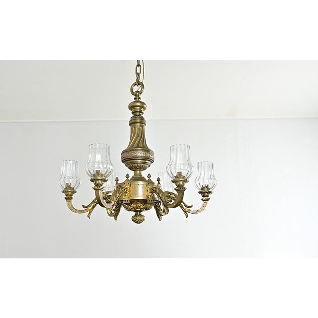 A spectacular and heavy French chandelier from the late 19th century, cast in bronze with abundant Neoclassical decorative...