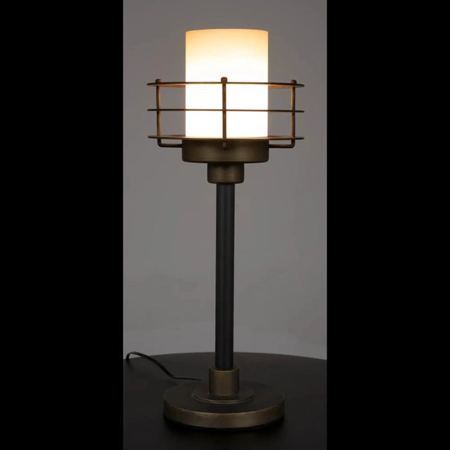 Illuminate your space with the elegant charm of this exquisite lamp, carefully crafted to exude timeless appeal. The...