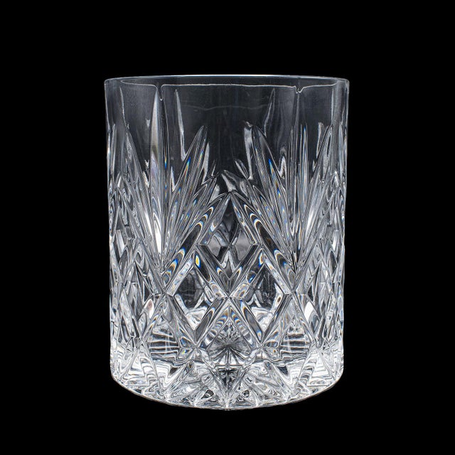 This is a vintage champagne bottle cooler. An English, cut crystal ice bucket for table presentation, dating to the late...