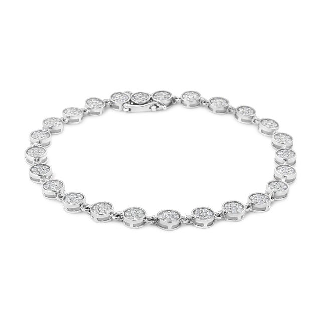 Flash effortless beauty with this stylish diamond link bracelet. This sterling silver diamond link bracelet presents the...