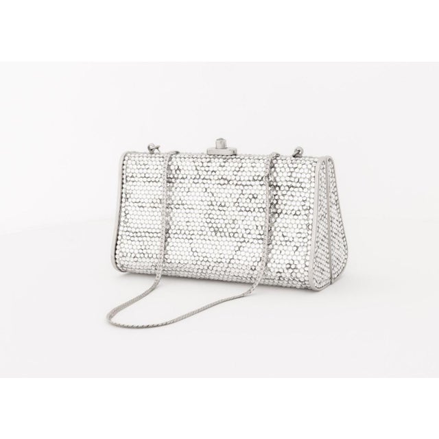 Judith Leiber Swarovski Crystal Covered Minaudiere, with optional silver-tone curb link chain strap, marked inside. 3.75"...