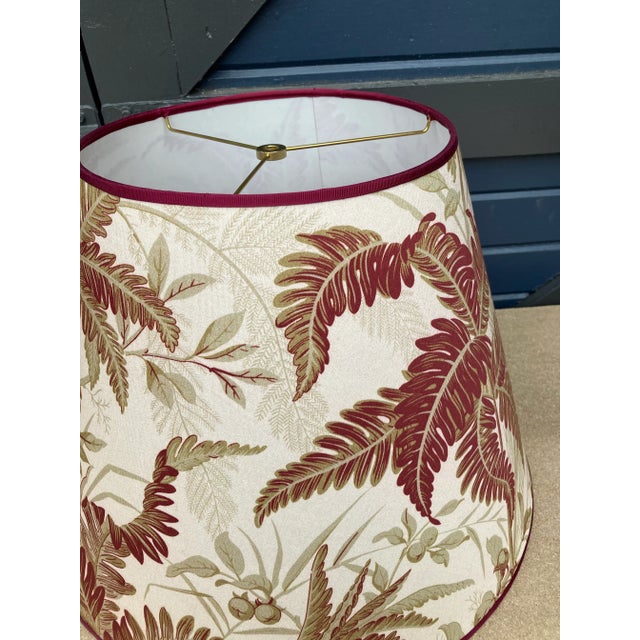 A lampshade handmade from a fern printed cotton. Measurements: top10” bottom 18” side 13”