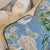Brunschwig & Fils Shishi dragon in teal showcases a fun asian floral print. Green cording and Quadrille cream backs add a...