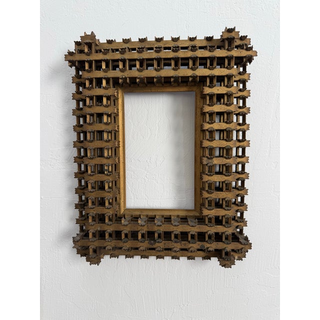 This frame is a work of art in itself. Painstakingly assembled using tiny pieces of wood, this masterpiece is one of a...