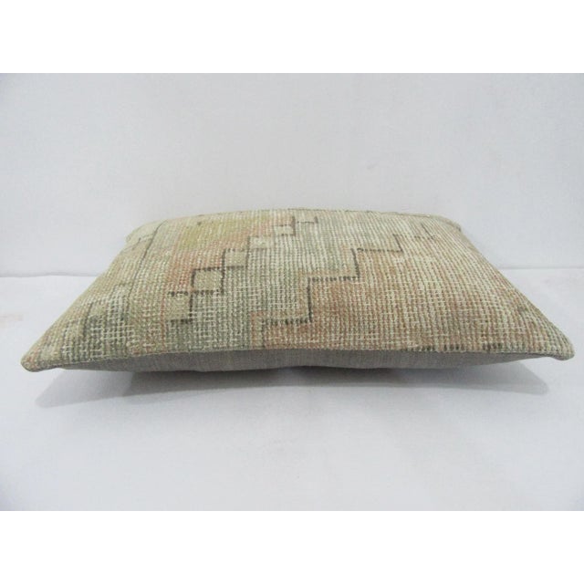 Decorative pillow cover made from a vintage Turkish handknotted rug. Backed with good quality cotton fabric. Pillow...