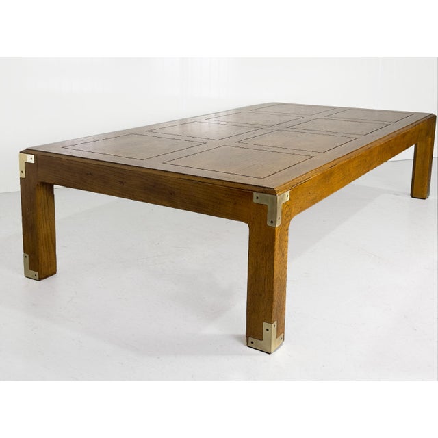 This Vintage Campaign Coffee Table Artefacts Collection by Henredon offers a timeless blend of function and form. Crafted...