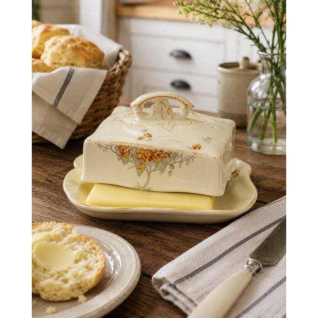 Vintage Alfred Meakin Marigold covered butter dish featuring a warm cream-colored glaze with delicate floral decoration...