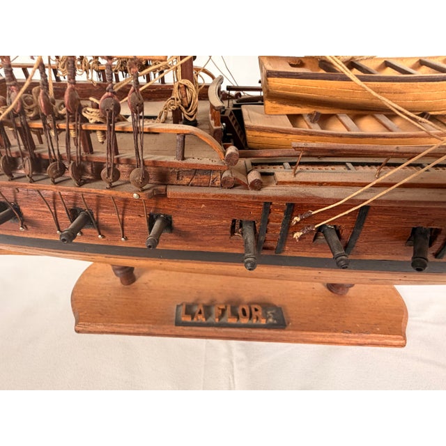 Finely detailed early 20th-century French model of the frigate La Flore, hand-constructed in wood and presented fully...