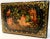 This is a vintage Russian black lacquer box that features dancing Fairies on the top. The borders have a dainty gold...