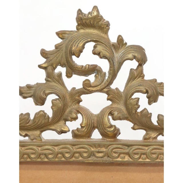 Vintage 1980s cast bronze picture frame with swirling foliage motifs. The picture size is 7.5 in. x 9.5 in. Manufactured...