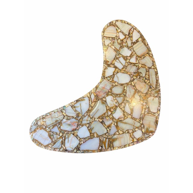 Mid-century coffee table featuring iridescent abalone shell fragments and quartz, embedded in polished resin....