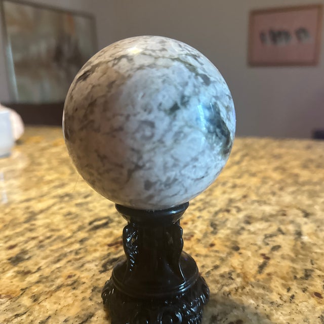 Bring organic elegance to your interior with this striking, hand-polished Rainbow Moonstone crystal sphere. Meticulously...