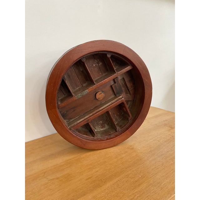 Likely used for shaping or casting small parts, this piece boasts a unique round design divided into numerous individual...