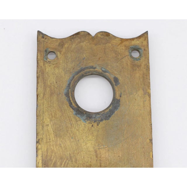 Gold painted door pull with a cylinder lock hole. One available. The manufacturer and exact date of creation are unknown....