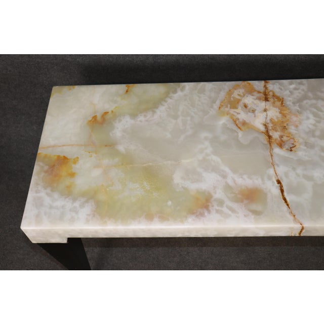 An elegant and sophisticated Italian-made console table in the French Art Deco style, distinguished by its substantial...