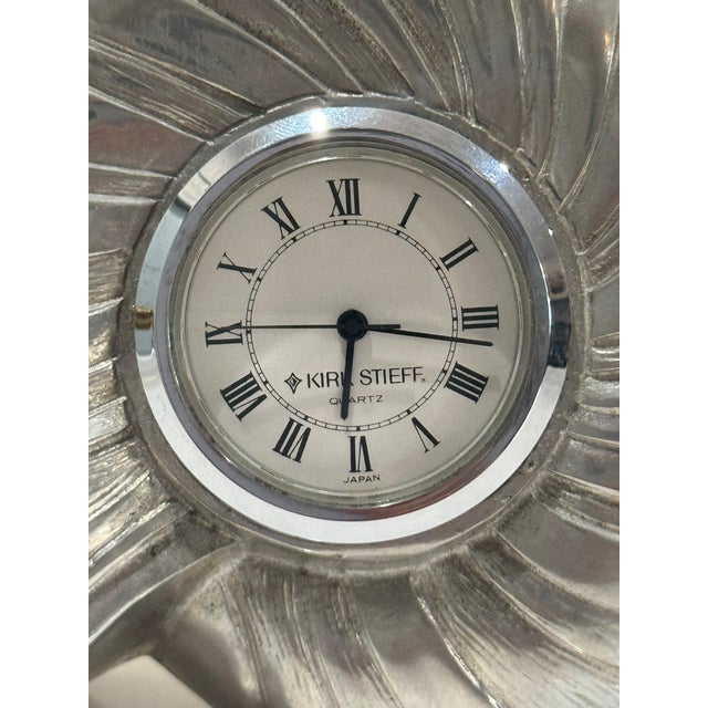 Elegant Kirk-Stieff pewter desk clock in the shape of a nautilus shell. This sculptural piece features a smooth, polished...