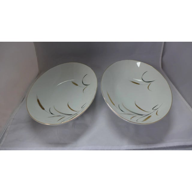 A pair of midcentury oval serving bowls. Maker's mark reads "Eternal Harvest, Japan." Circa 1960s. 10.5" L x 7.75" W x...