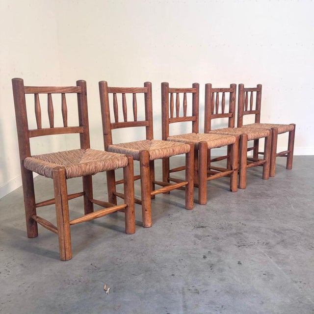 Remarks: Set of five Belgium farmer chairs, 1960s Pine wood frames with wicker seats. All in vintage condition condition....