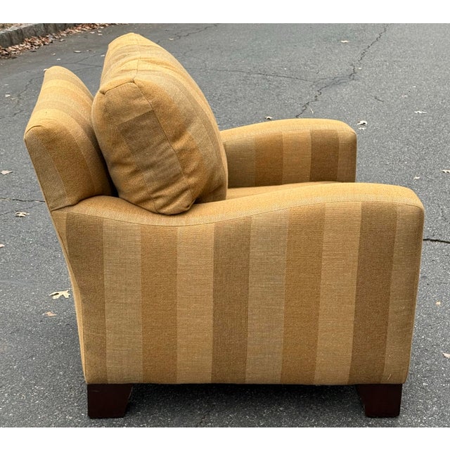 Impeccably handcrafted chair by A Rudin made in California. The curved track arms adds a modern touch to the classic club...