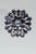 An impressive pair of stunning, flower motif stud earrings comprised of pear-shaped iolite gemstones with a round cabochon...