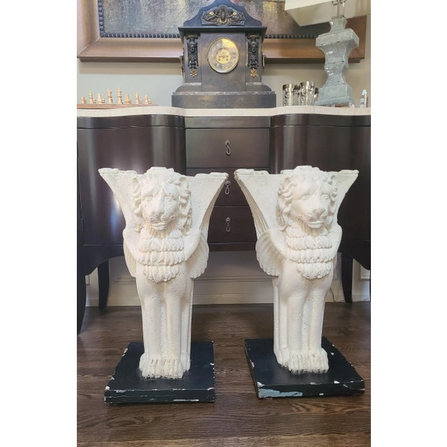 Here is an estate sourced vintage pair of stately mythical creatures ready to support an object of your imagination or act...