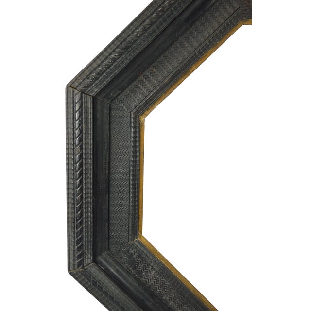 An anitique Dutch ripple ebonized molding frame with a gilt edge inner edge. The frame would be suitable for an old master...