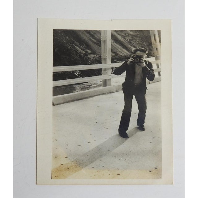 Mis 20th century snapshot photograph of man taking a picture with his camera. Unframed.