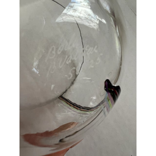 This bowl with multi colored earth toned rainbow stripes is a work of art. This art glass bowl is made by celebrated...