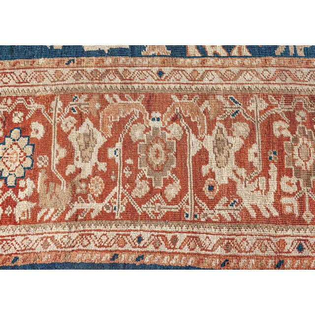 A finely hand-knotted wool antique Persian Sultanabad rug dating back to circa 1930. The design consists of an allover...