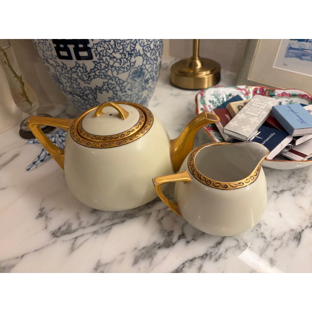 Stunning Art Deco teapot and creamer set in exceptional condition—no cracks, no chips, no crazing. These two pieces are a...