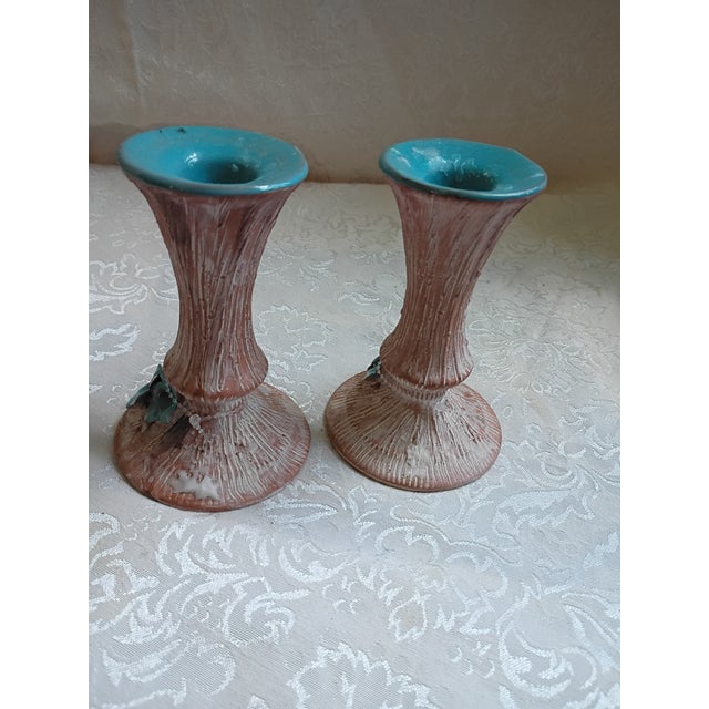 Add a touch of organic texture to your tabletop with this charming pair of vintage ceramic candle holders. Featuring a...