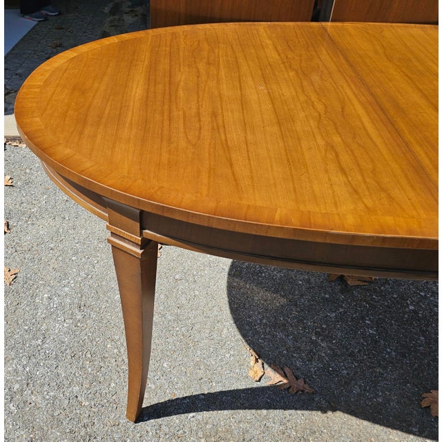 Refinished Mid-Century Drexel Consulate Series Fruitwood Walnut Dining Table with two extension leaves. Newly and...