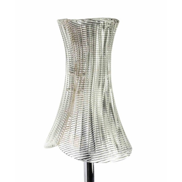 Vintage floor lamp is an original design lamp realized in the 1970s in Italy. A vintage lamp realized in Murano glass and...
