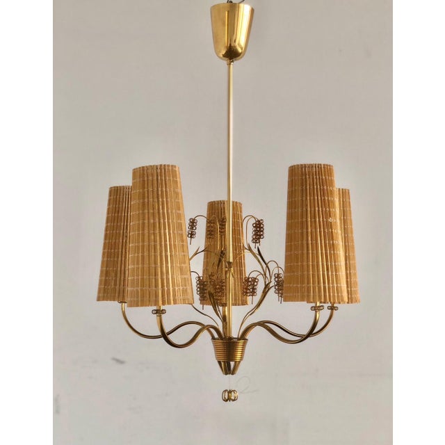 A Chandelier designed by Paavo Tynell for Taito Oy, Model 9015. Finland , circa 1940th. Marked ” OY TAITO AB 9015 ”....