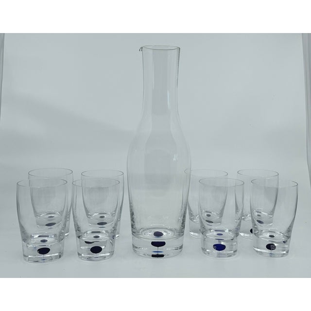 Fine Swedish Orrefors crystal 12" carafe with a set of 8 Blue Dot Intermezzo glasses, 8 oz., 4 1/2" tall. New with...